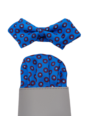 Pajarita azul tinta círculos rojos